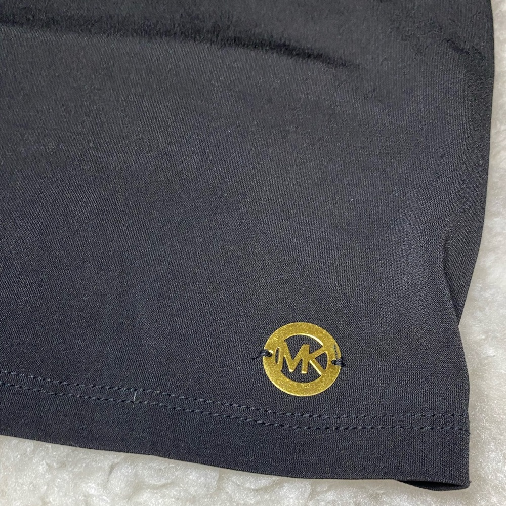 Woman’s Michael Kors with detailed cutouts on shoulders